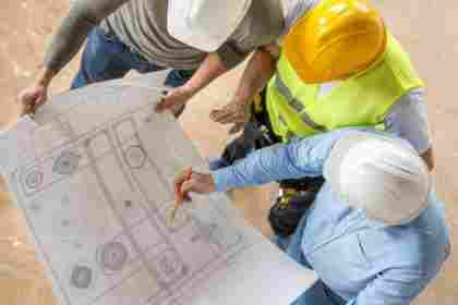 civil-engineers-looking-at-blueprints-473683922-5c14287446e0fb00014ad74b